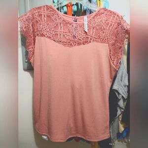 Soft pink colored top with a lacey edge, nvr worn